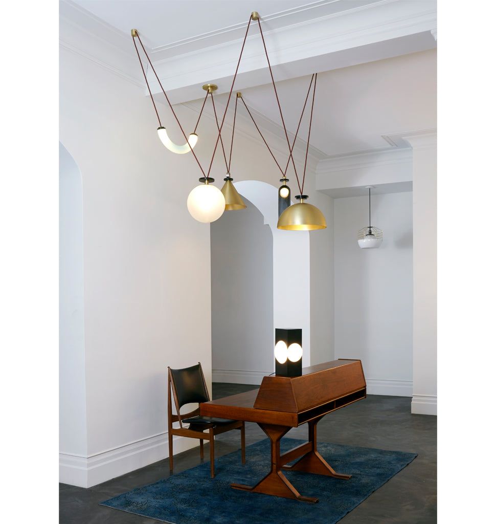 5-Piece Chandelier (Brushed brass cone/Brushed brass hemisphere) — Roll & Hill, New York City. Image by Joseph De Leo